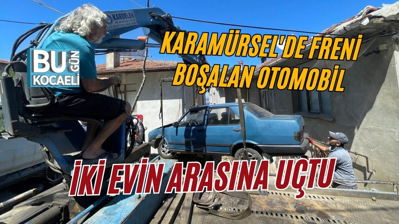 KARAMÜRSEL'DE FRENİ BOŞALAN OTOMOBİL İKİ EVİN ARASINA UÇTU