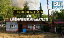 Elinde Hortumla Evini Yangından Kurtarmaya Çalıştı
