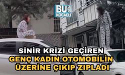 Sinir Krizi Geçiren Genç Kadın Otomobilin Üzerine Çıkıp Zıpladı