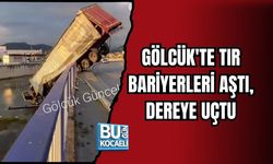 GÖLCÜK'TE TIR BARİYERLERİ AŞTI, DEREYE UÇTU