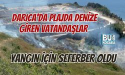 DARICA'DA PLAJDA DENİZE GİREN VATANDAŞLAR YANGIN İÇİN SEFERBER OLDU